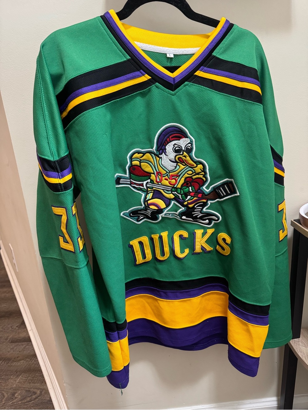 Green Anaheim Ducks Hockey Jersey with Yellow & Purple Accents